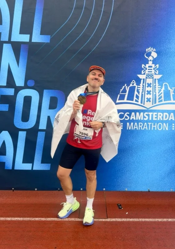 Finishing the TCS Amsterdam Marathon with medal